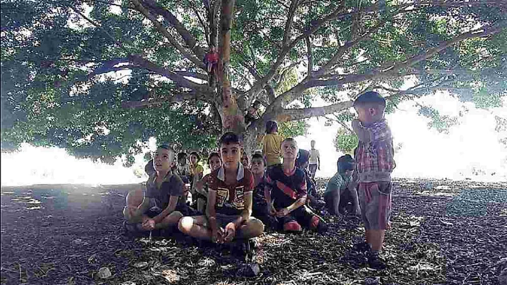 Image: At the Internally Displaced People camp in Syria, these children are some of the innocent victims of the Syrian civil war wait to be photographed by Iranian photographer Amir Kabir Jabbari