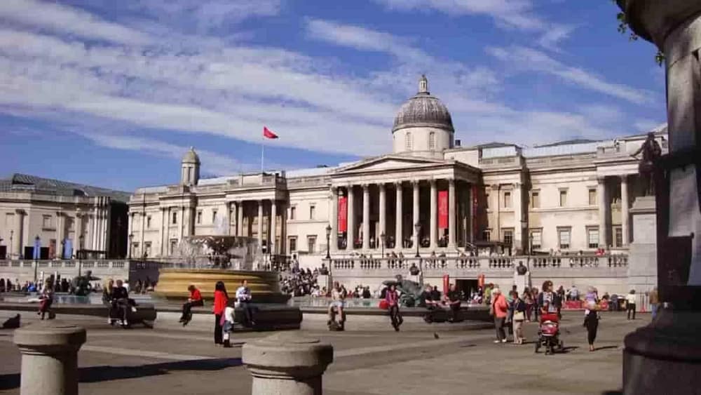 Entrance on the North side of Trafalgar Square. The newer Sainsbury Wing can be seen at the far left. Founded in 1824, the National Gallery contains over 2300 paintings, dating from the 13th Century to 1900. The new National Gallery Security measures aims to protect art and visitors.