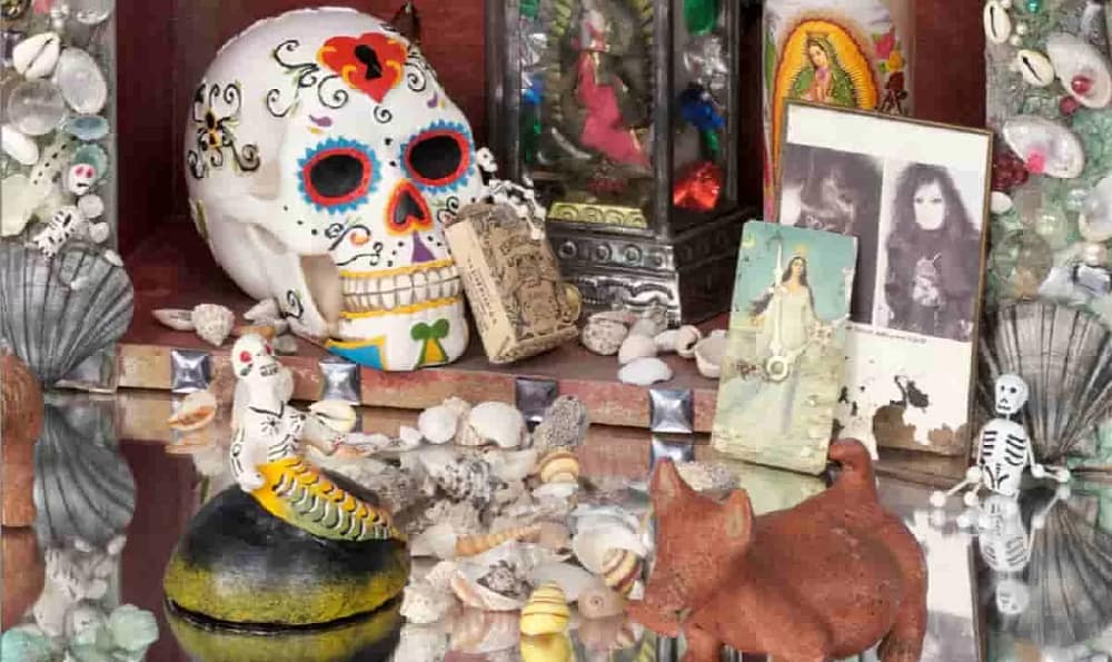 Amalia Mesa-Bains, Queen of the Waters, Mother of the Land of the Dead: Homenaje a Tonantzin/Guadalupe (detail), 1992. Mixed media installation including fabric drape, six jeweled clocks, mirror pedestals with grottos, nicho box, found objects, dried flowers, dried pomegranate, potpourri; 120 x 216 x 72 in