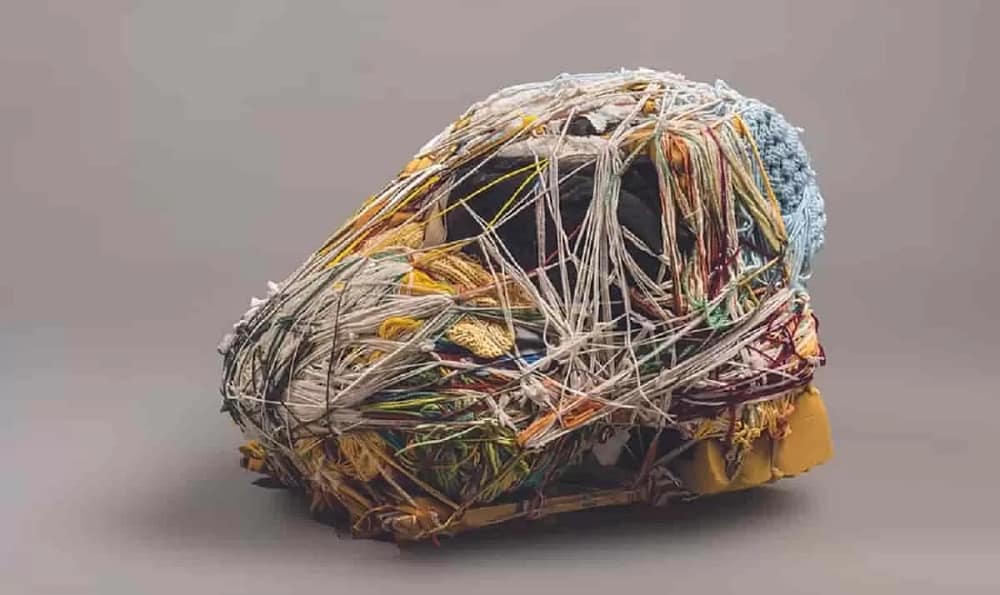 Detail of Green Monkeys Mandril, a fiber art sculpture by artist Judith Scott made from Fiber and found objects