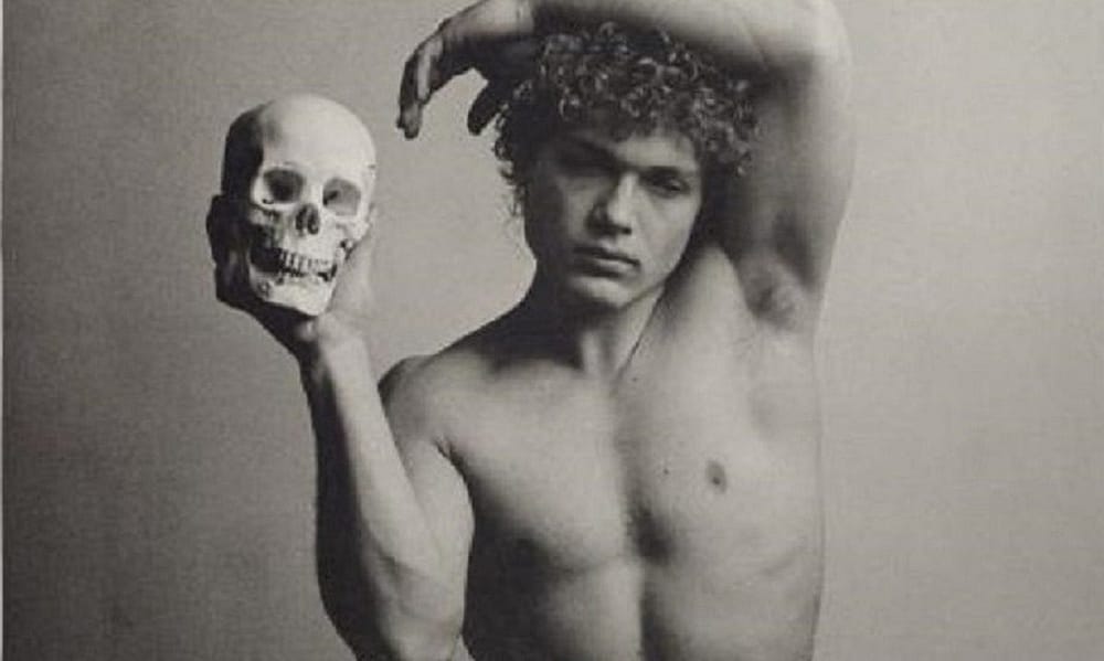 LGBTQ Artists Pride Month Celebration: A photograph of a boy with a human skull titled All Things Mellow in the Mind, by Duane Michals, one of the artists in The Ringling exhibition