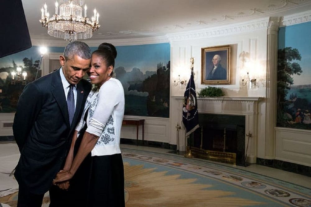 President Barack Obama and Michelle Obama snuggle in the Diplomatic Reception Room of the White House in an open display of affection