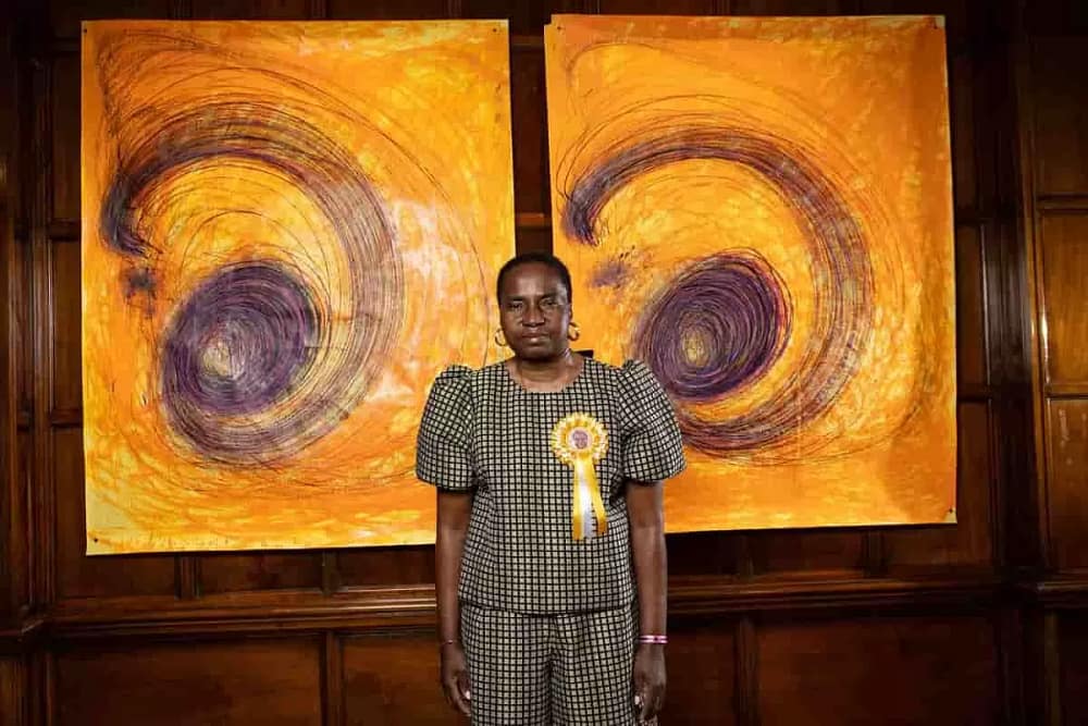 Nnena Kalu Turner Prize winner of the 2025, in front of one of her paintings.