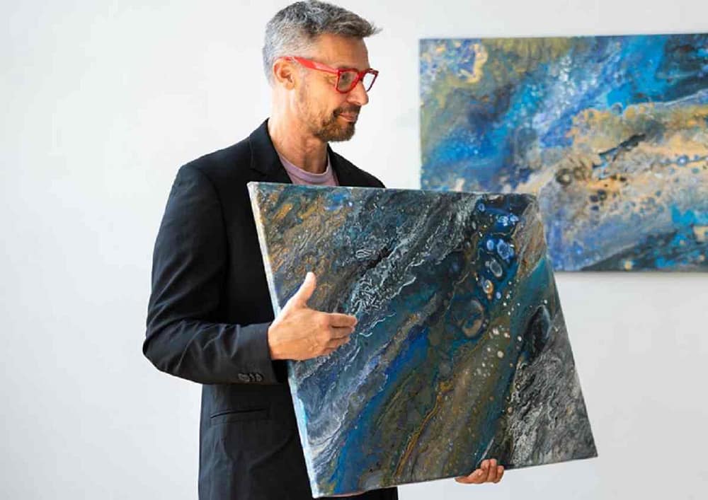 Artist prepares for an art sale. You shouldn’t underprice your work as an artist