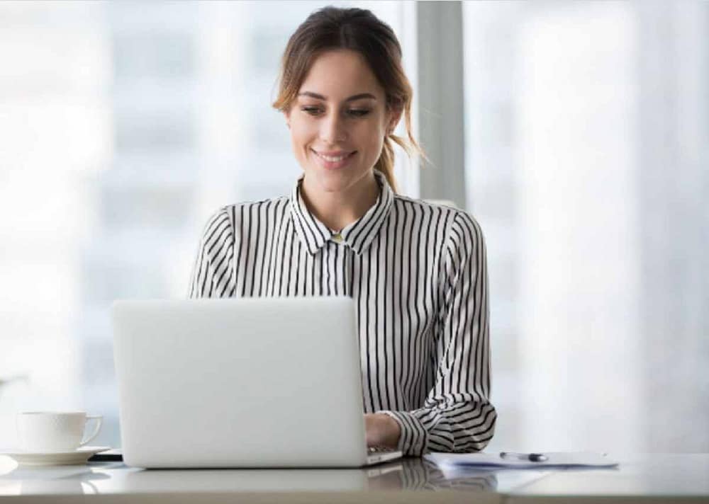 The lady on the laptop is a reminder that selling prints of your artwork online involves using social media platforms