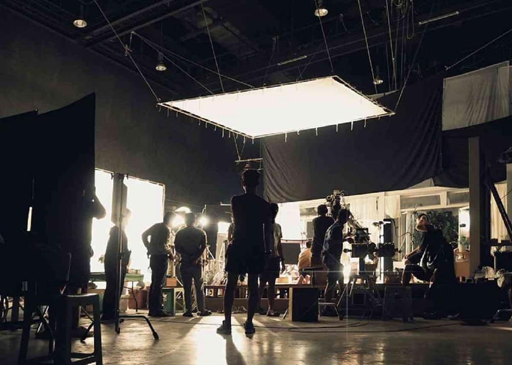 Film lighting production crew at work on iconic movie examples of different film lighting