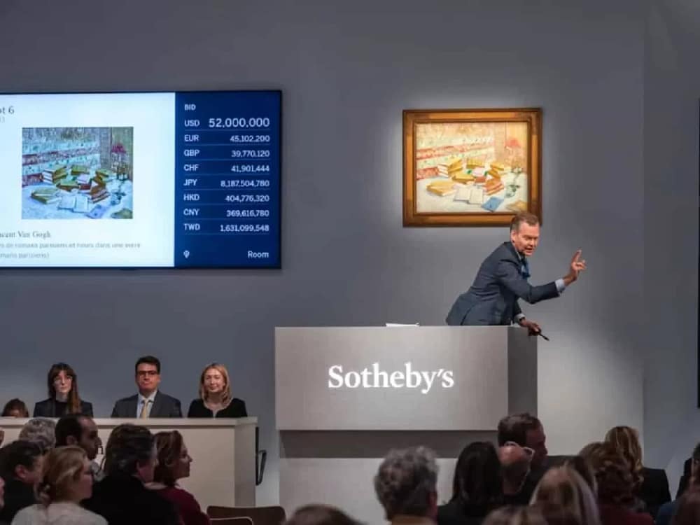 The auctioneer at work during the Sothebys auction where Frida Kahlo auction record put women artists on a strong pedestal.
