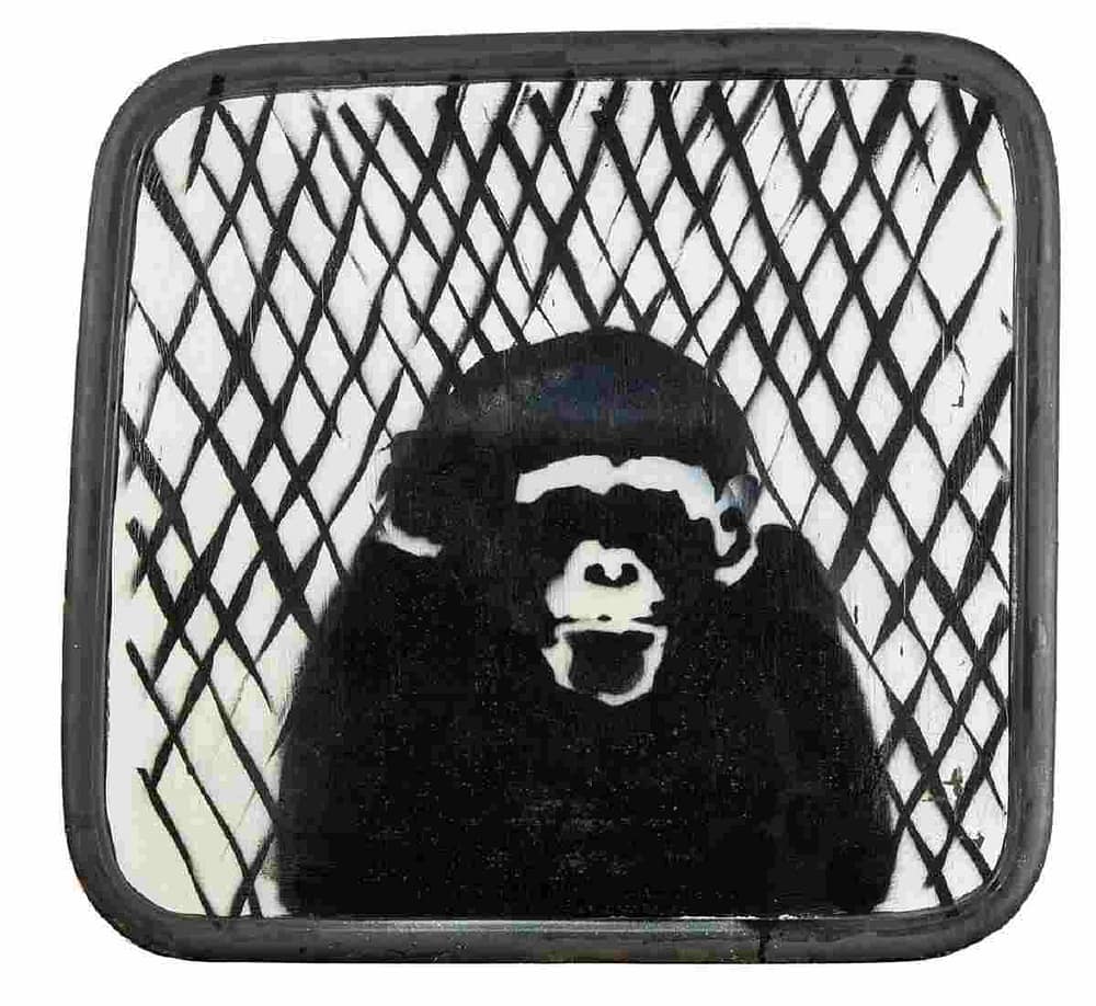 Banksy,  Untitled Police Van Chimp 2003. One of the urban street art at the auction.