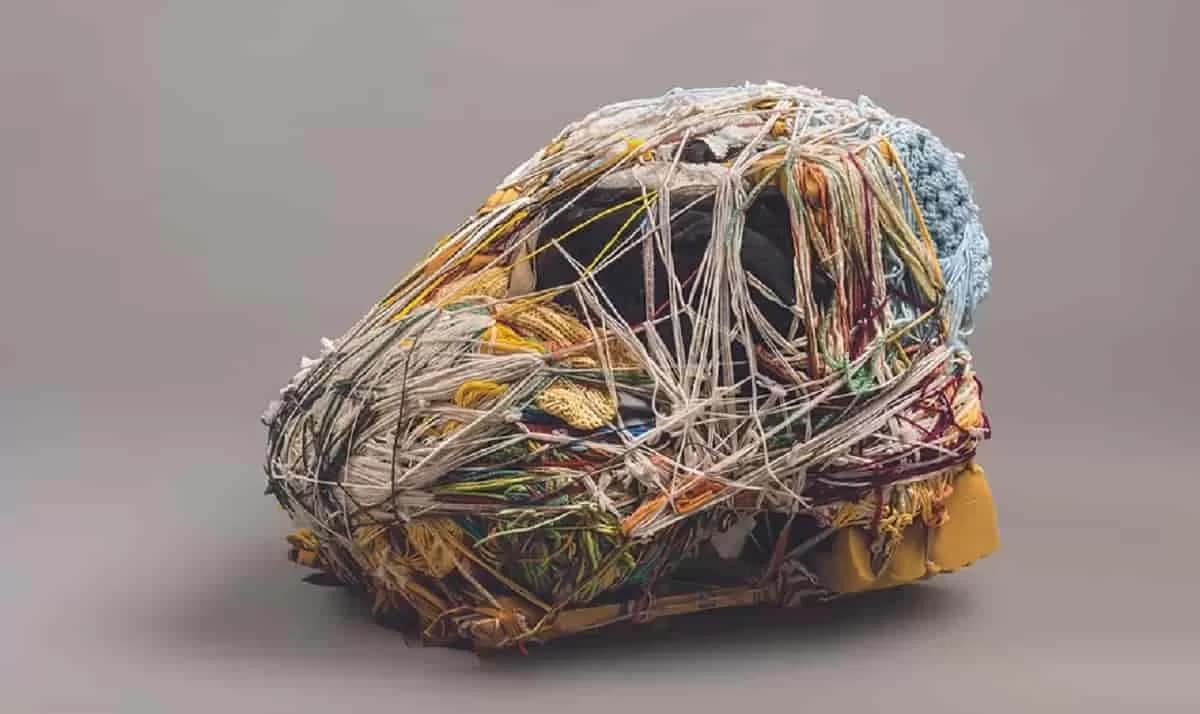 Detail of Green Monkeys Mandril, a fiber art sculpture by artist Judith Scott made from Fiber and found objects