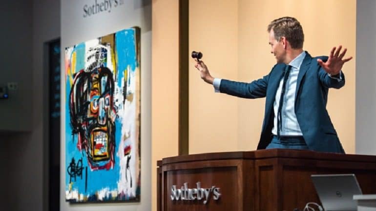 Image: Jean-Michel Basquiat 'Untitled', an acrylic, spray paint and oilstick on canvas painting, been auctioned at Sotheby's by the enthusiastic auctioneer.