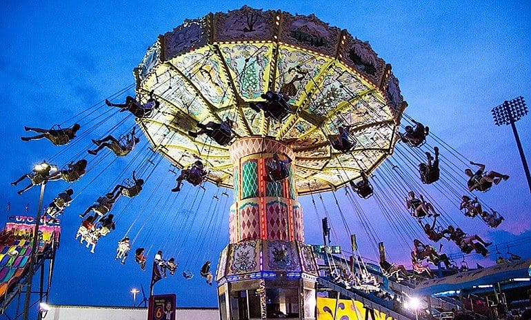 Image: Canadians on one of the amusements at the Canadian National Exhibition in Toronto having fun