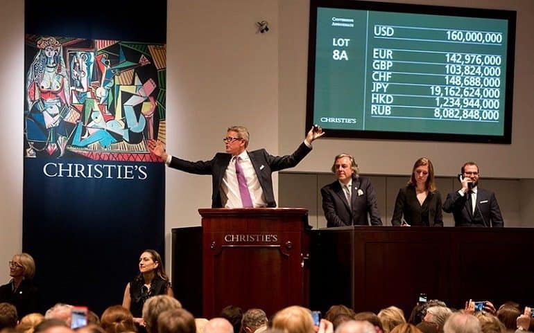 Record Auction-Image: Christie’s Global President Jussi Pylkkanen at the rostrum during the auction of Picasso's Les femmes d’Alger, Version O from 1955 that made record auction at the Looking Forward to the Past auction