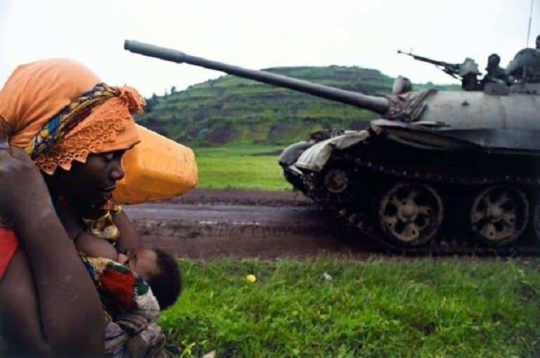 Image: War Photographer Walter Astrada (Argentine, b. 1974) captures a Congolese women fleeing to Goma, from the series Violence Against Women in Congo, Rape as Weapon of War in DRC, 2008
