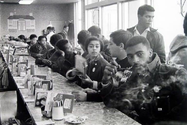 Image: Group photo of African American men and women during the civil right movement. It is the sit in by SNCC staff and supporters at a Toddle House -Civil Rights Movement