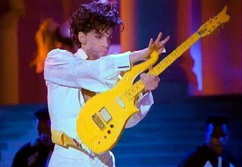 Image: Prince playing the Iconic Yellow Cloud Electric Guitar