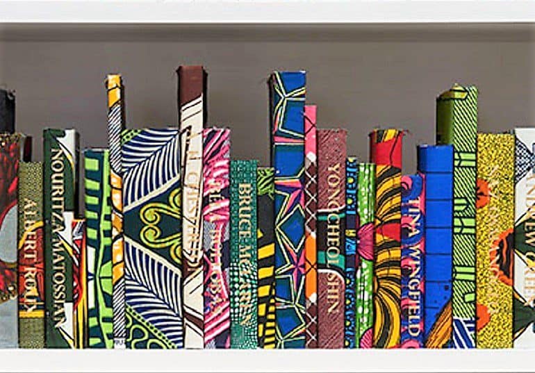 Image: The American Library Collection (Activists), a large-scale installation made of books wrapped in Dutch wax print fabric by the Britain-Nigerian artist Yinka Shonibare MBE has been acquired by Mead Art Museum