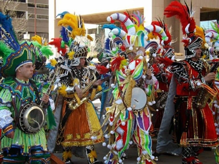 Image: A group of colorfully dressed musicians on parade during St. Patrick’s Day Parade in Baltimore help celebrate Creative Exposure Baltimore (CEB)