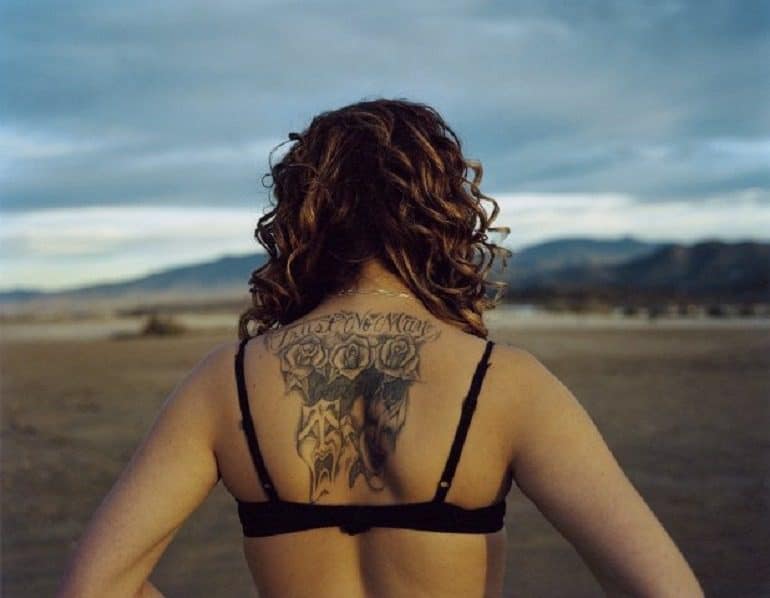 Image: Trust No Man: one of the working girls at the Nevada Brothel shows her tattoo, an indication of life experience
